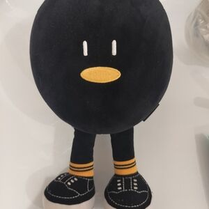 Black Plush Toy with Yellow Accents